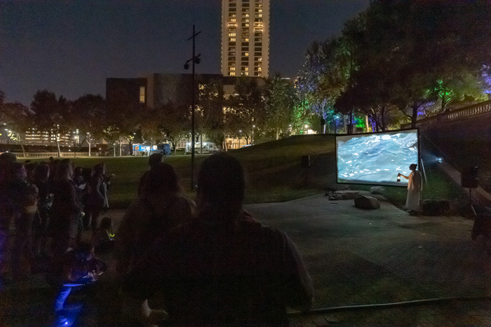 Screen on column in lobby showing water flowing over rocks